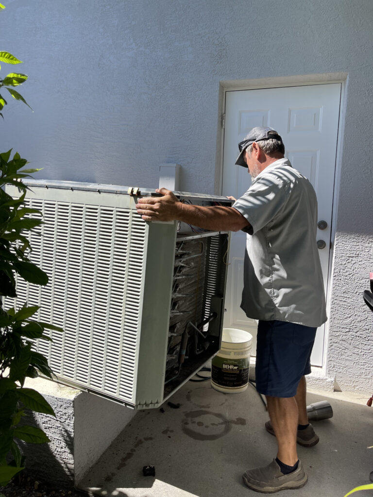Boyd Brothers technician installing an AC unit at a customer’s home in Southwest Florida