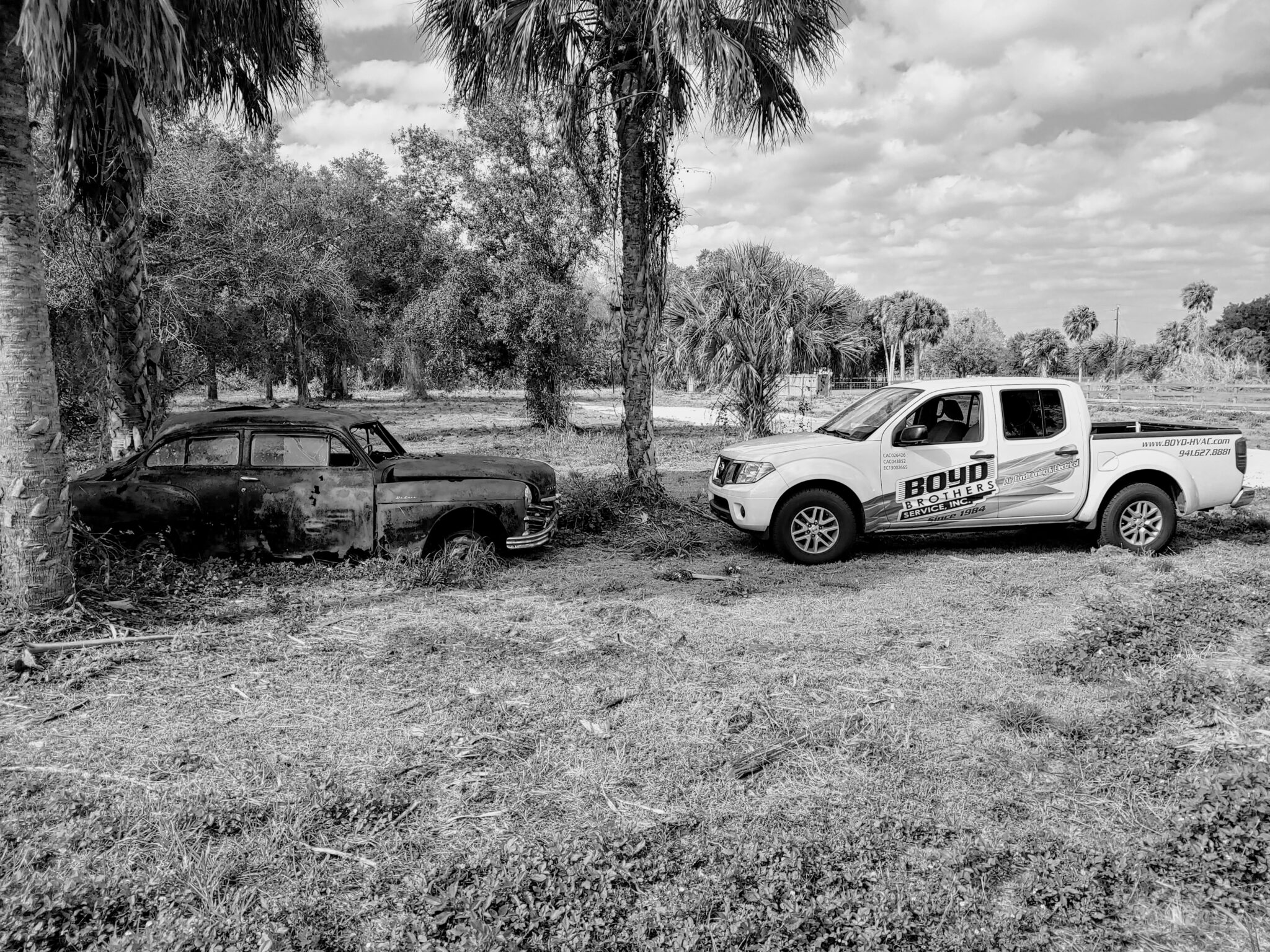 Old and new Boyd Brothers Service Inc pickup trucks side by side