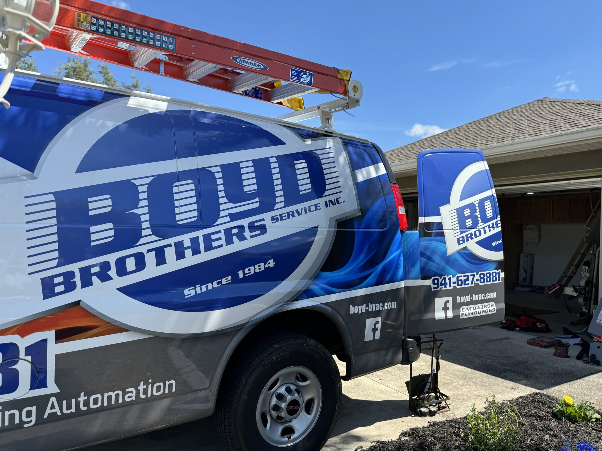 Side view of a Boyd Brothers Service Inc cargo van truck with logo