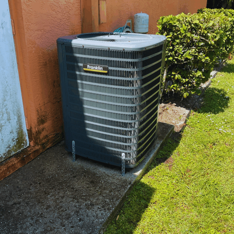 Outdoor Franklin brand air conditioning condenser unit installed beside a home.